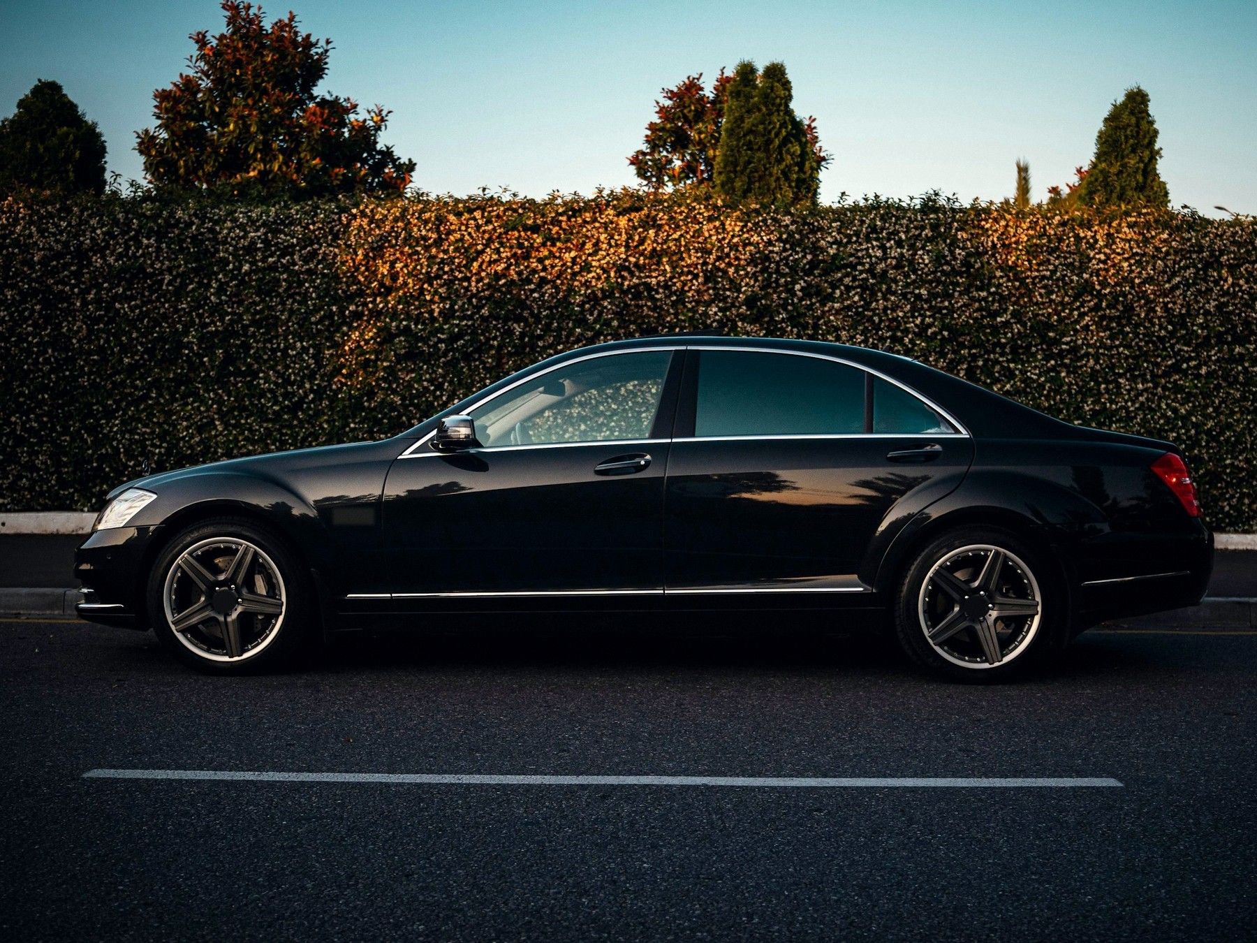 Black saloon car at the kerb