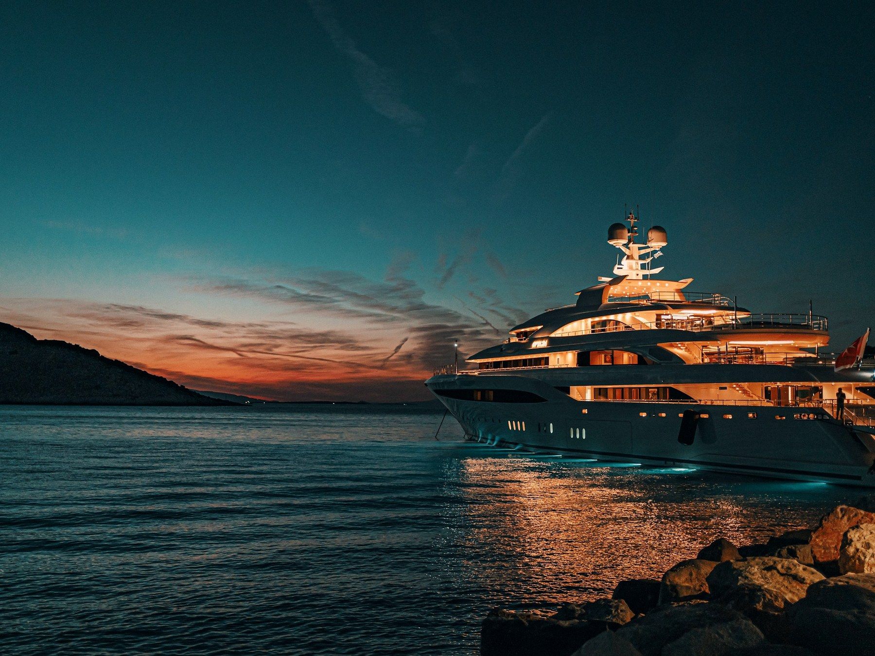 Motor yacht at anchor at dusk
