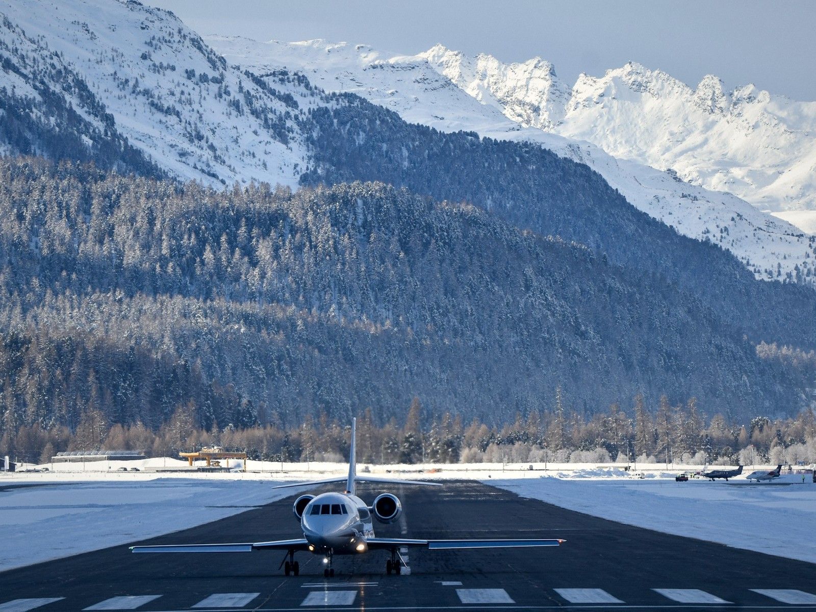 Business jet on a runway in the Alps